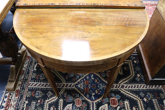 A George III demi lune table, W.92cm